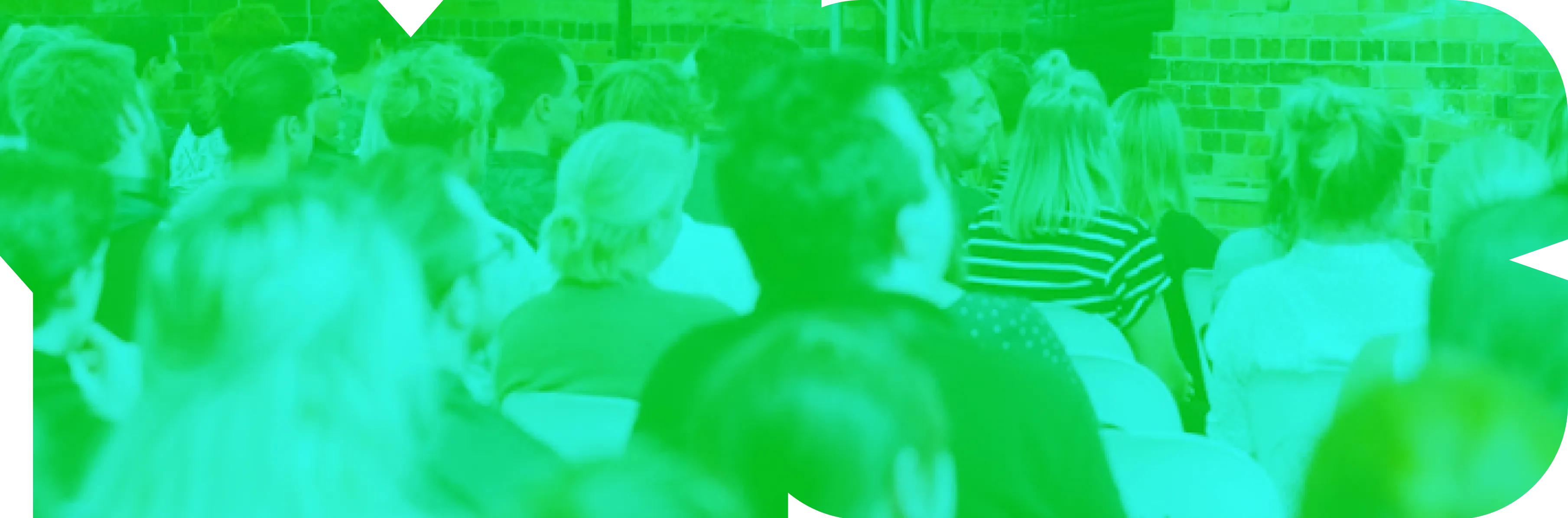 A group of people standing around each other.