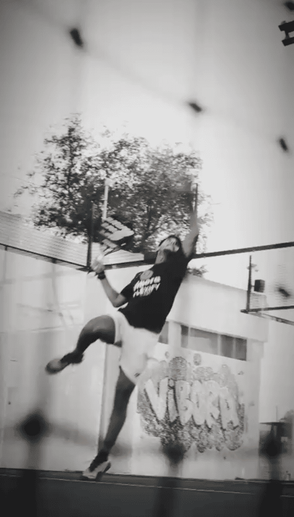 Abstract wavy lines gradient in yellow and orange on a soft blue-gray background.