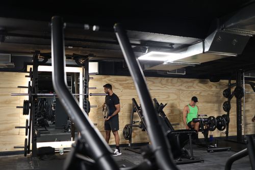 Modern gym interior with functional and strength training zones