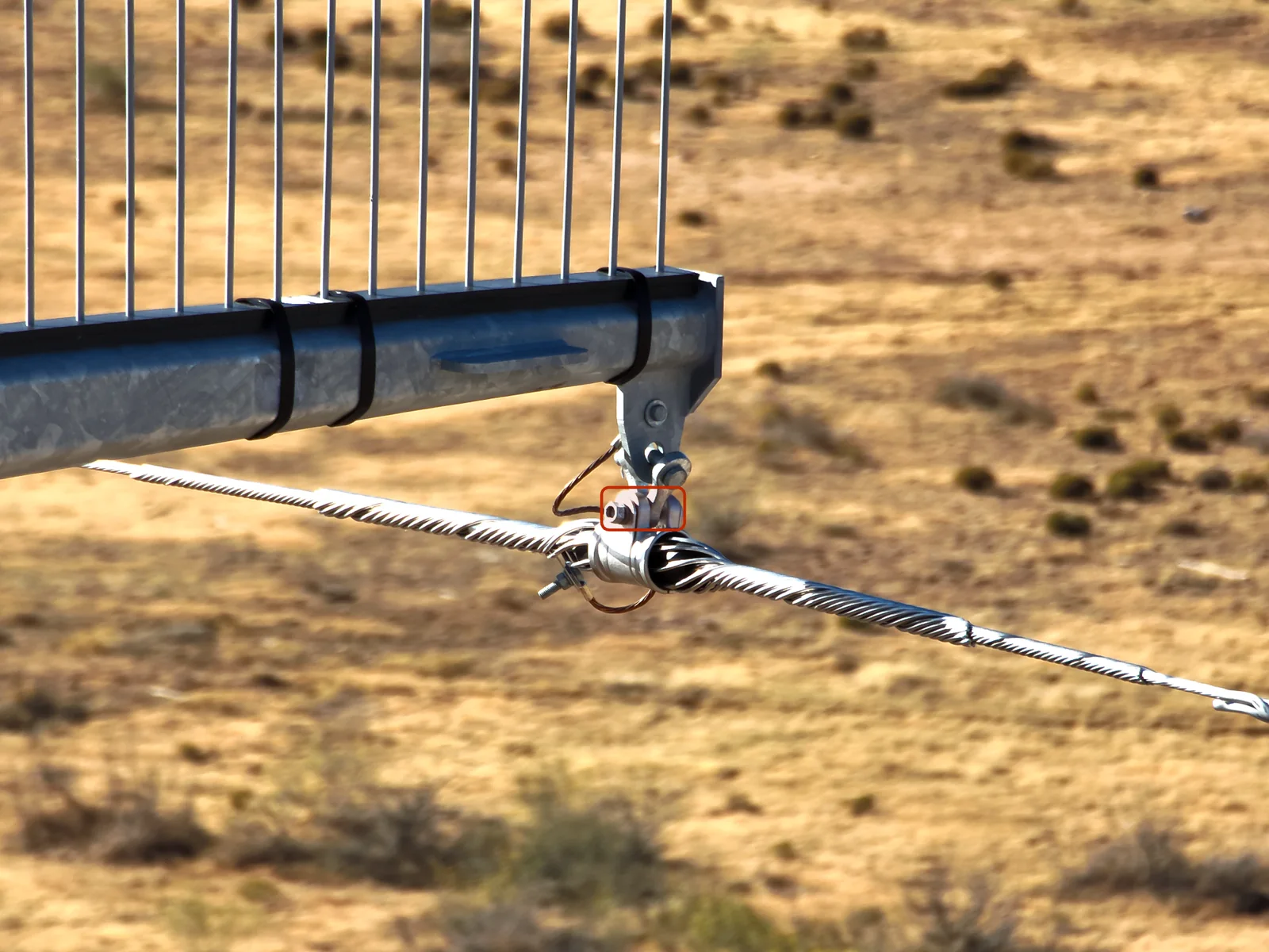 Drone close-up of transmission hardware with a flagged cotter pin defect