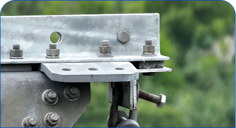 Bolted transmission tower bracket with a shackle and hanging bolt
