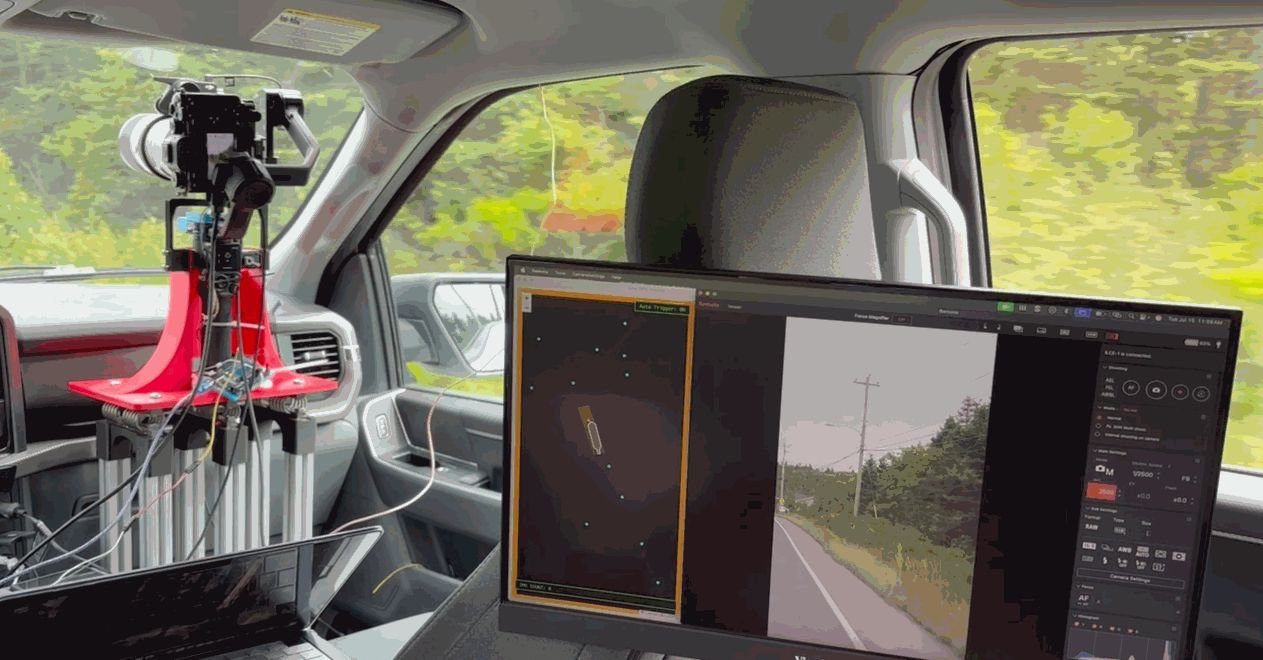 In-cab capture station in month 4: stabilized camera on a rigid mount beside a monitor showing the live camera view and the operations map