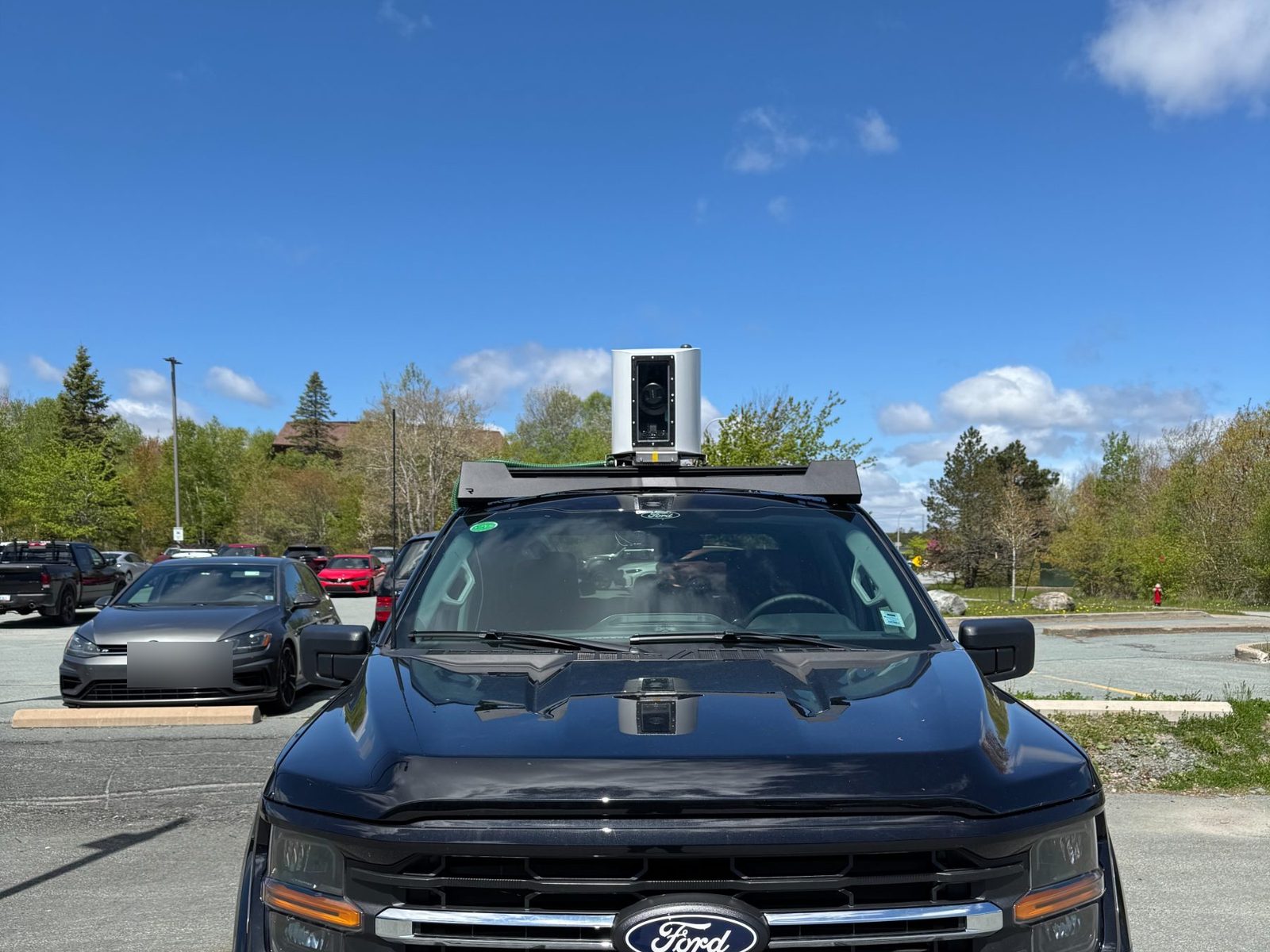 Front view of the Detect survey vehicle with the roof-mounted, weatherproof capture enclosure
