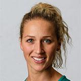 Photo of Erin Bell, with blonde curly hair tied back and blue eyes in front of a white background. Client Testimonial.