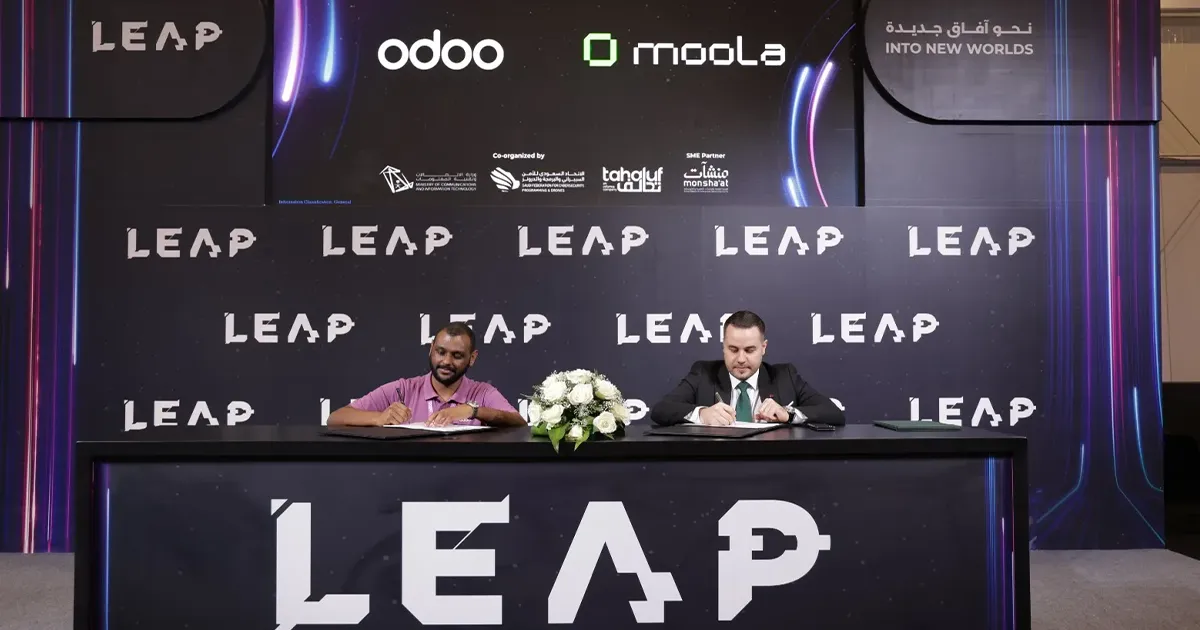 Hands holding a tablet displaying financial data with text highlighting how Bayt Al Jaleed cut manual expense work by 80% and boosted financial transparency by 90% using Moola in 12 weeks.