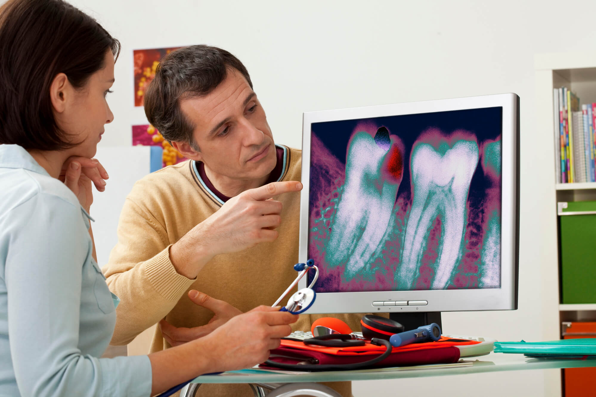 the Best Dentists in Coral Gables taking at look at some xrays
