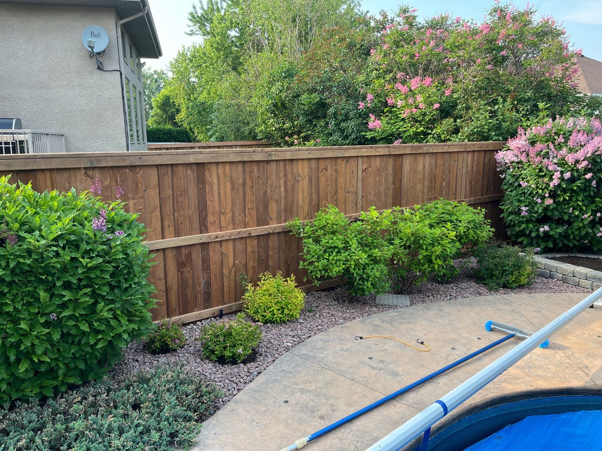 New Fence in beautiful landscaped yard