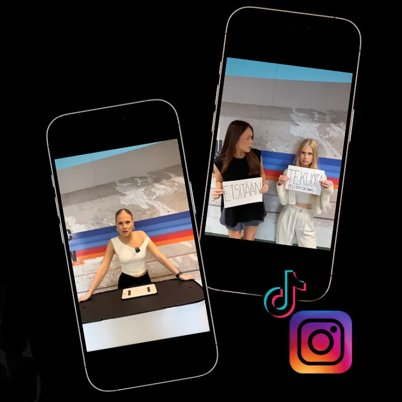 Two smartphones display videos of young women; one shows a woman standing behind a desk, the other shows two women holding signs with Finnish text against a striped wall.