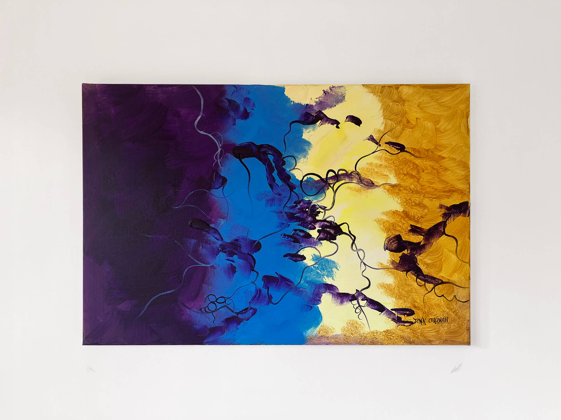 Abstract painting featuring vibrant orange and yellow hues, with blue, and black colours blending together in a dynamic composition.