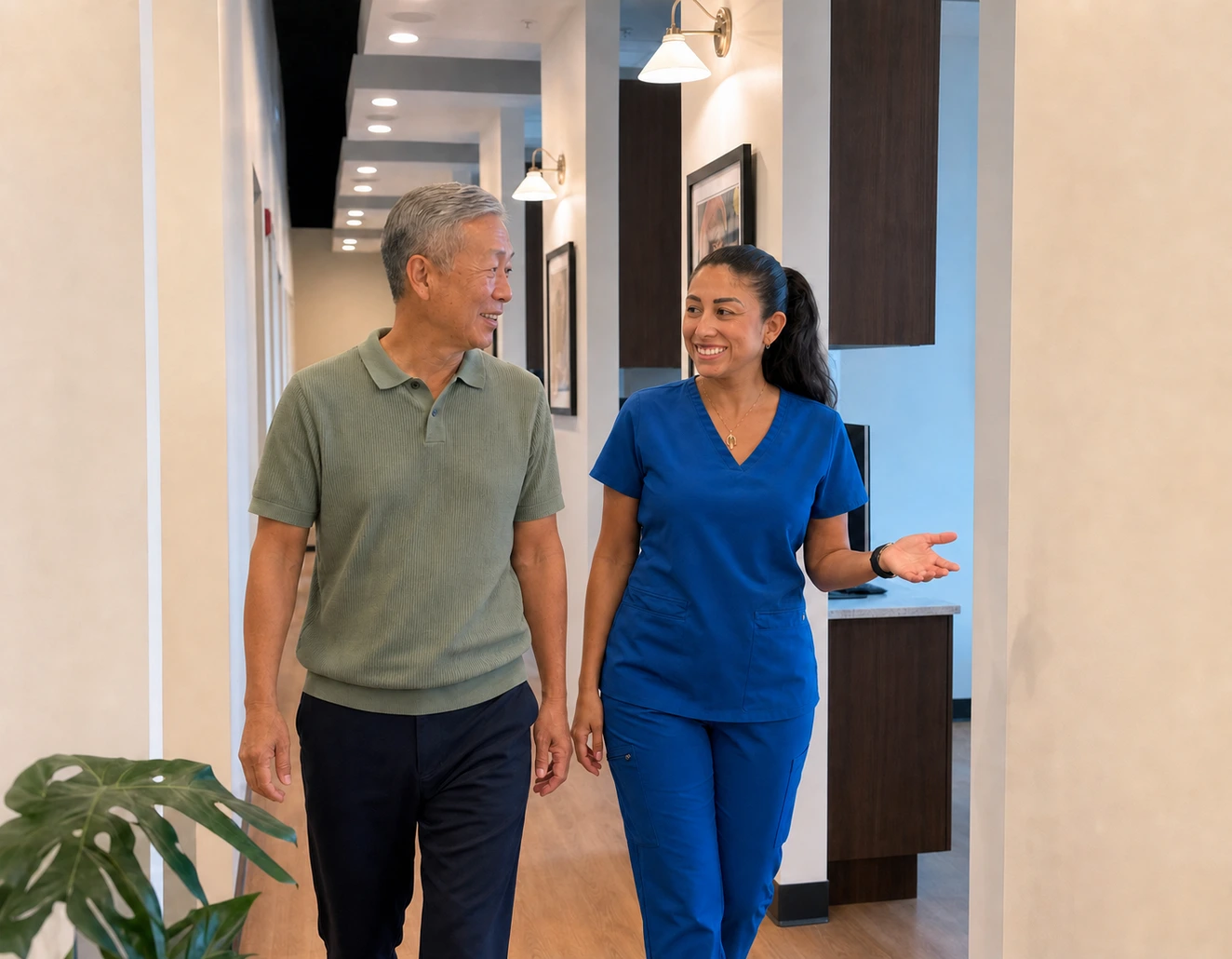 Rinse Dental team member guiding a patient through the office