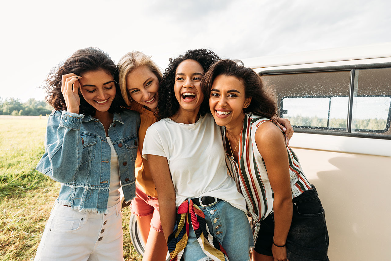 A group of young women standing next to each other.