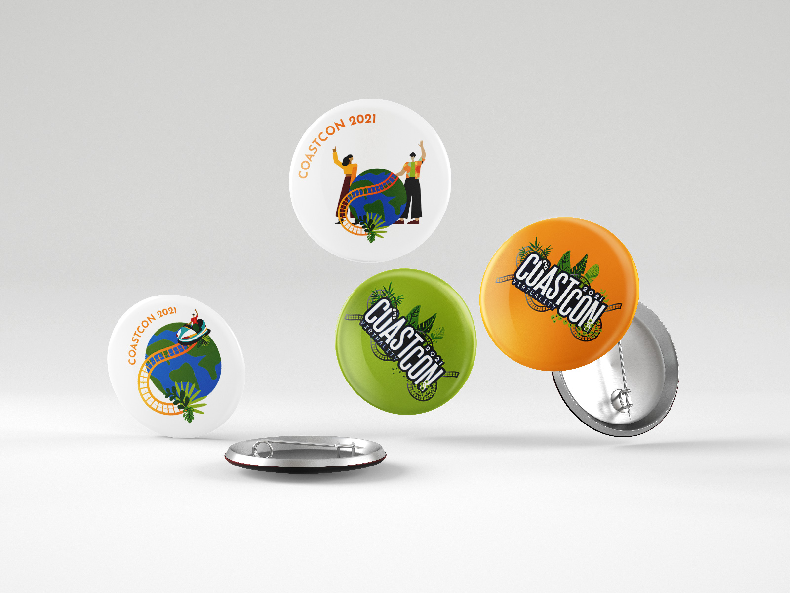 Five round CoastCon 2021 pins featuring earth, roller coaster tracks, plants, and people on white, green, and orange backgrounds.