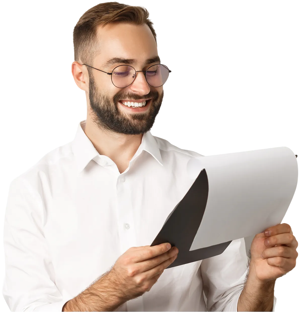 Smiling man with glasses and beard reading a document on white background.