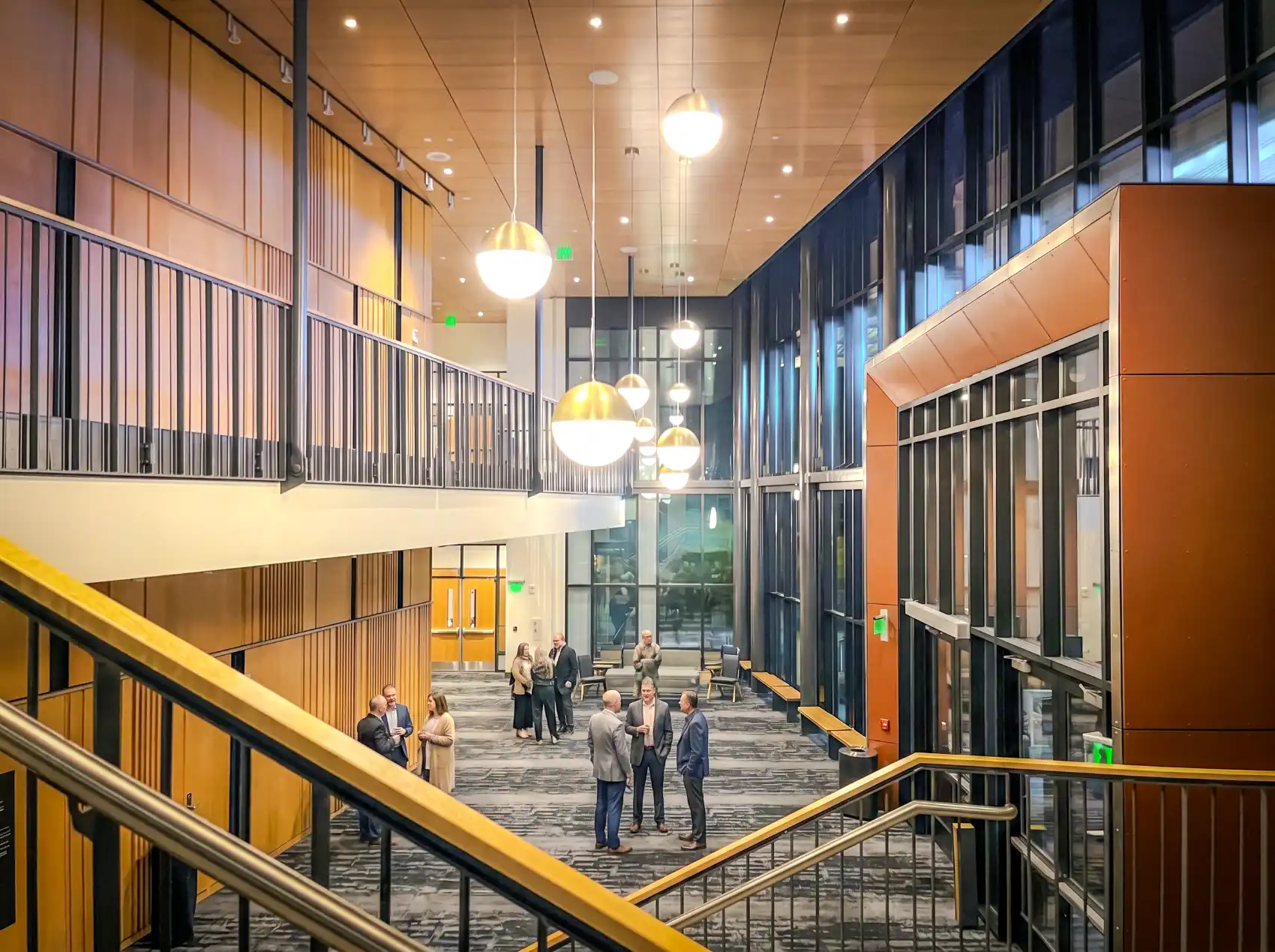 High school interior common space with students engaged in a variety of activities