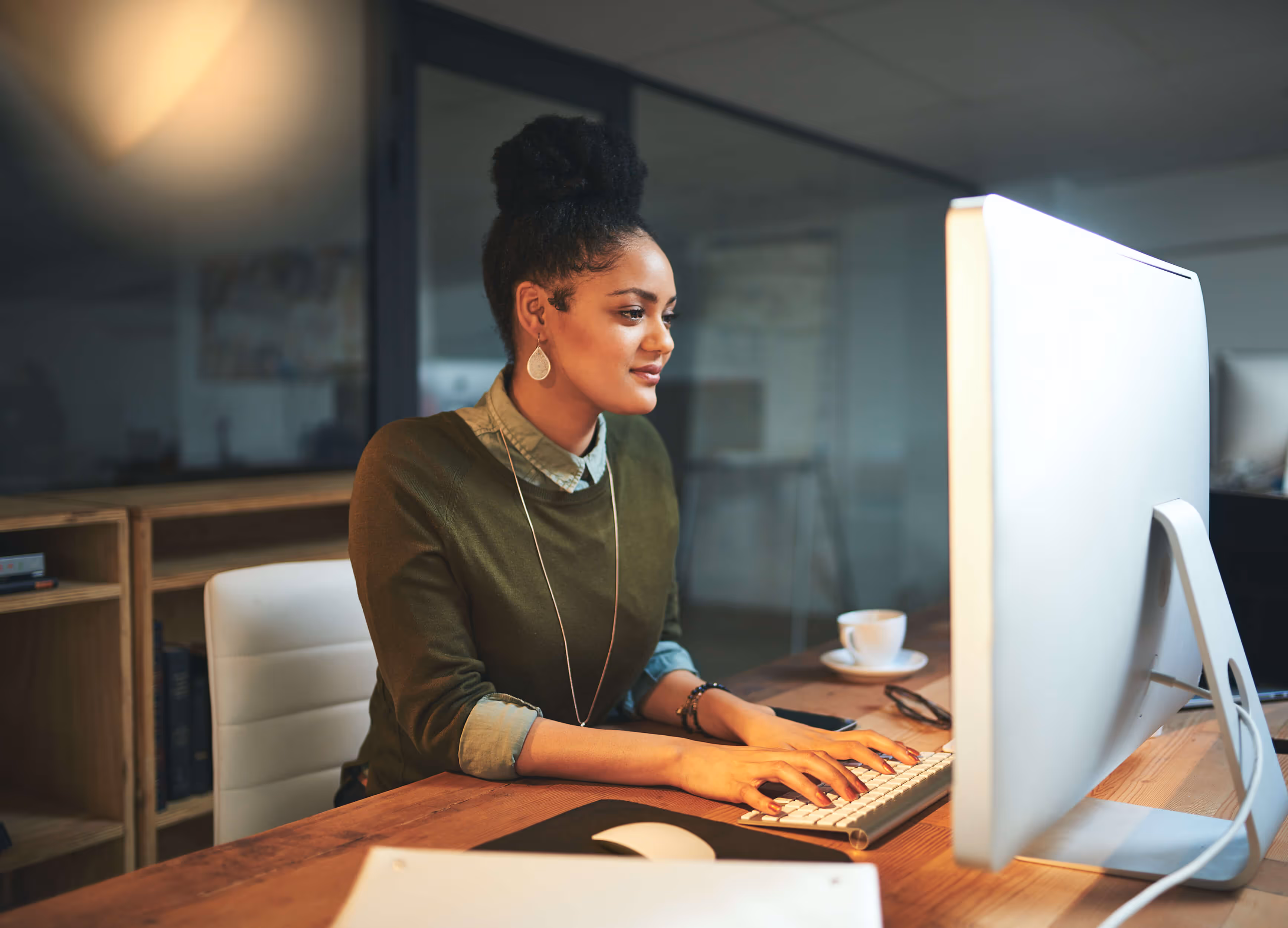Two boys and an elderly couple sitting on a couch, one boy taking a selfie while the other makes a funny face.