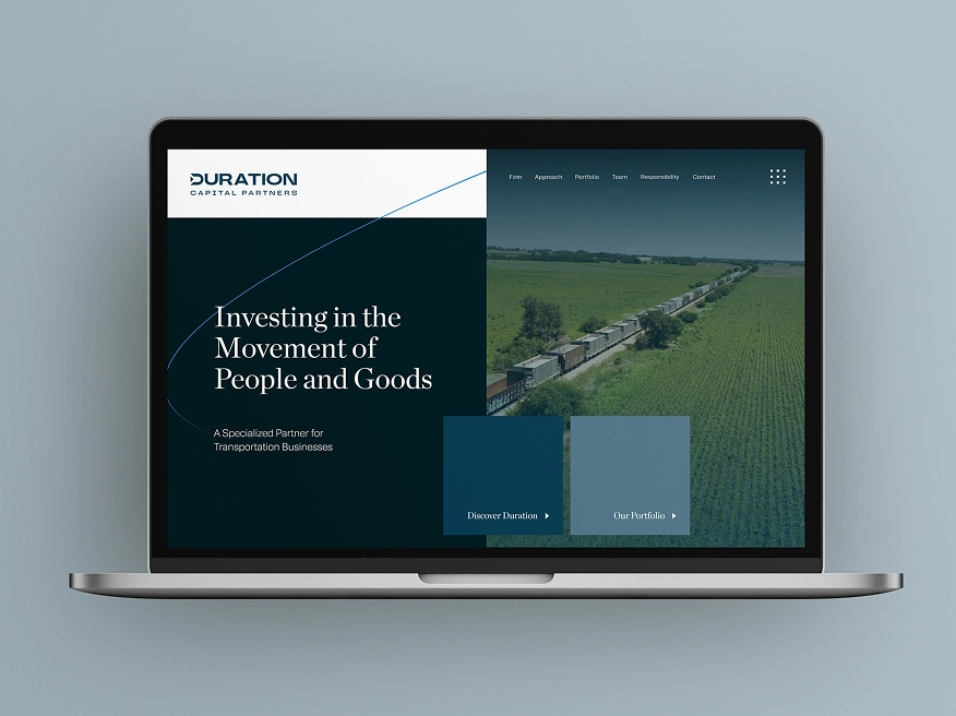 Laptop screen showing Duration Capital Partners website with tagline 'Investing in the Movement of People and Goods' and an image of a long freight train moving through green fields.