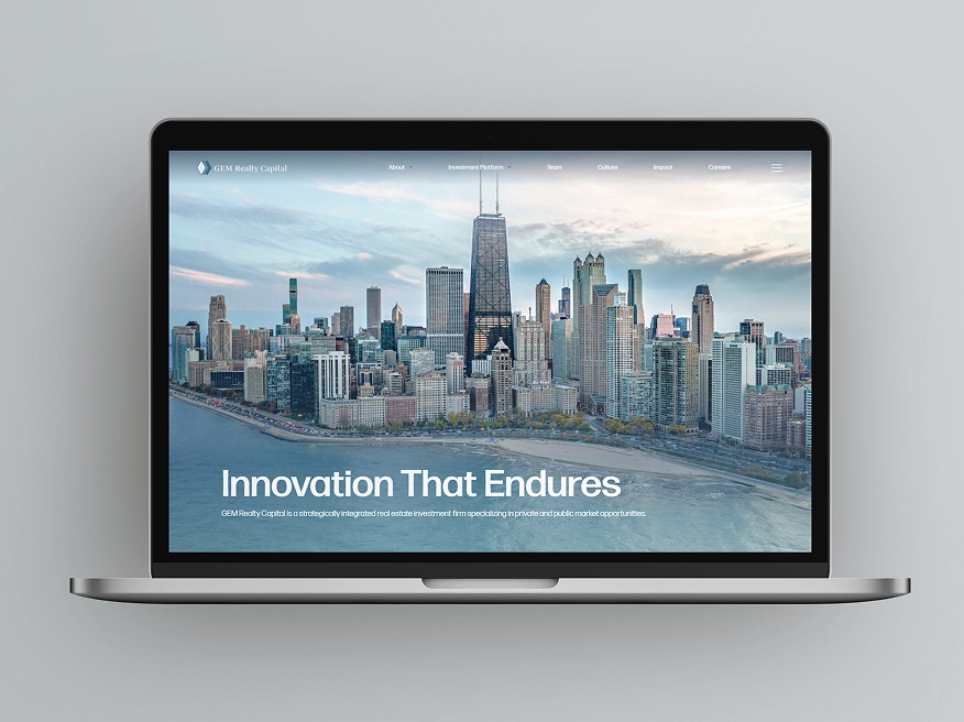 Laptop screen displaying GEM Realty Capital website with a city skyline and the text 'Innovation That Endures'.