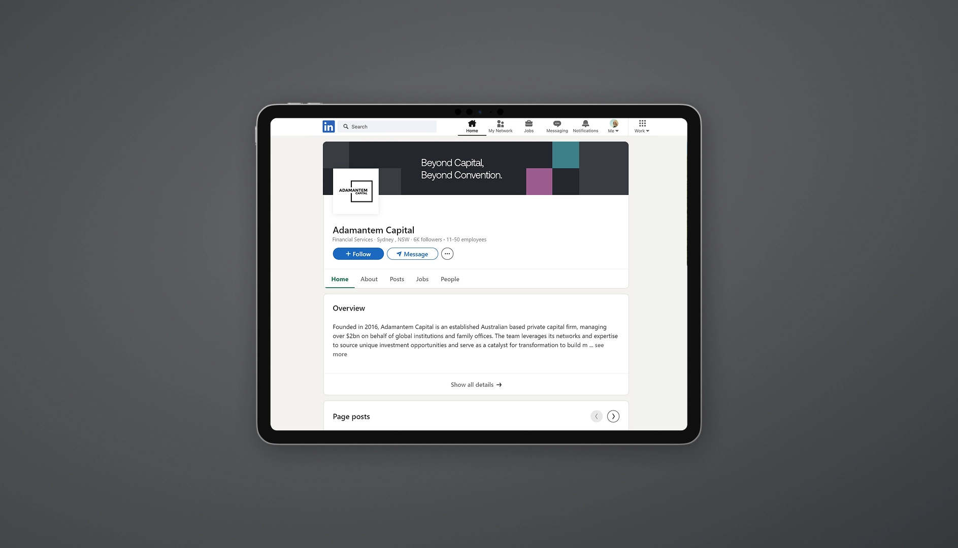 Tablet displaying Adamantem Capital LinkedIn company page with overview of the Australian financial services firm.