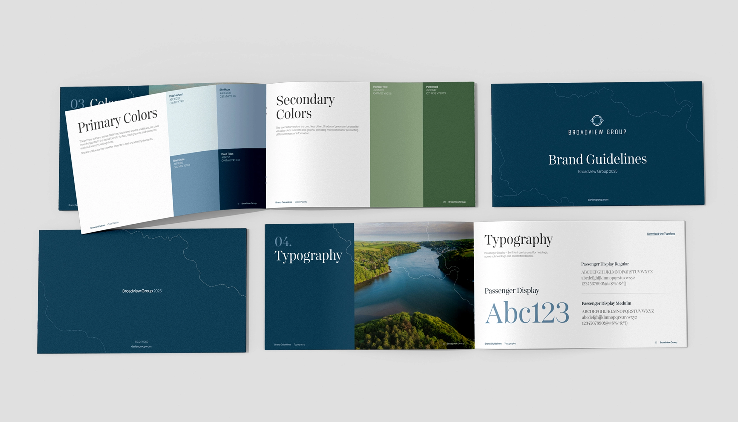 Open brand guidelines booklets showing sections on primary and secondary colors with color swatches, and typography with font samples and a river landscape image.
