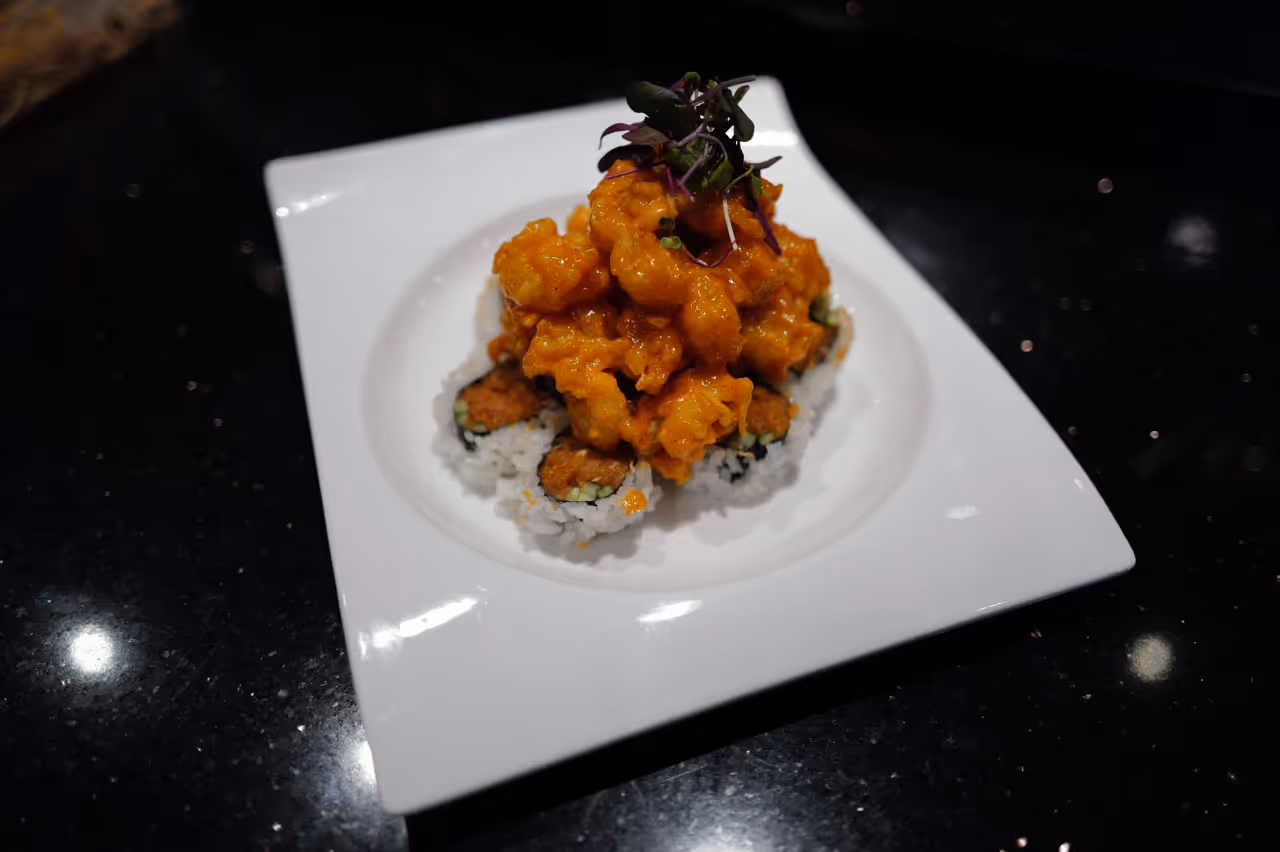 A white plate with a piece of food on it.