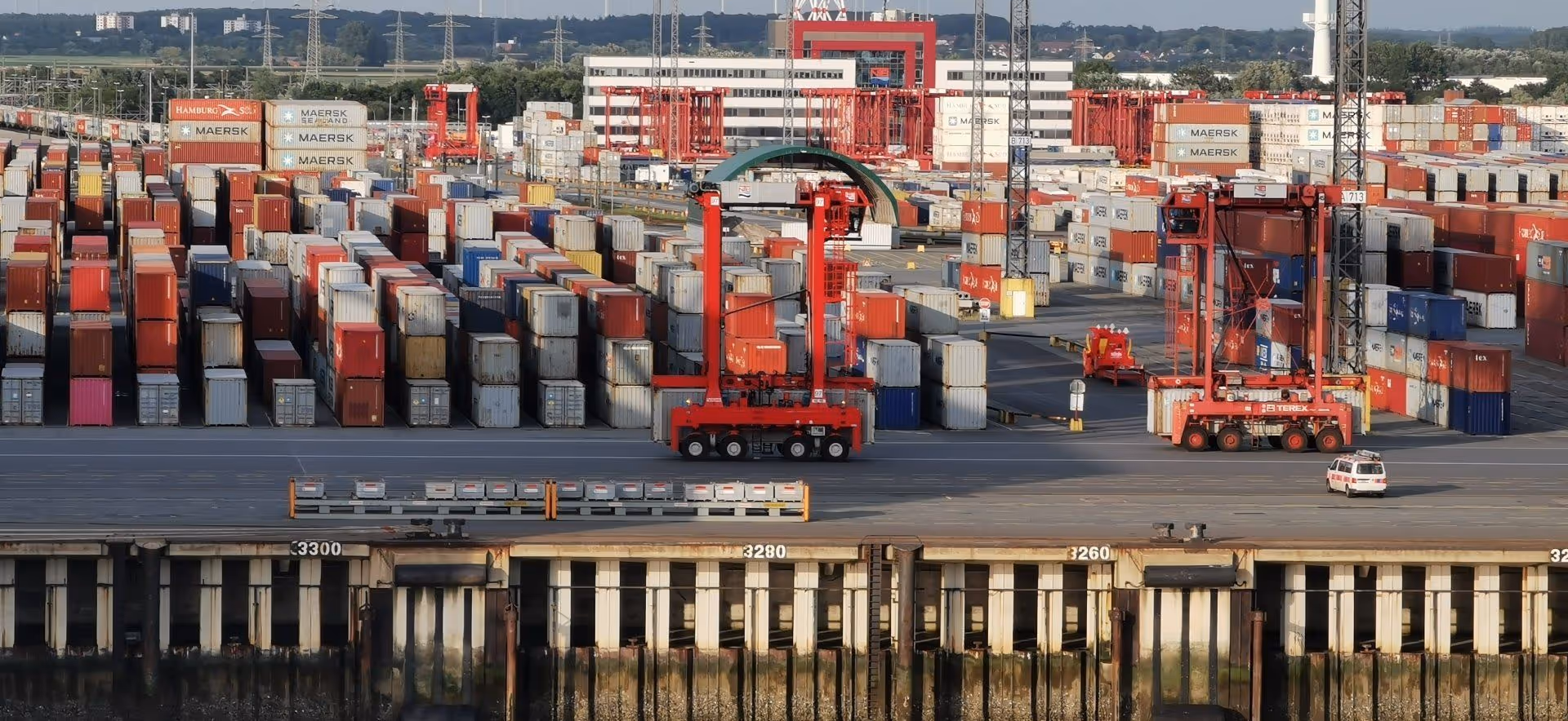 Container port with red gantry cranes