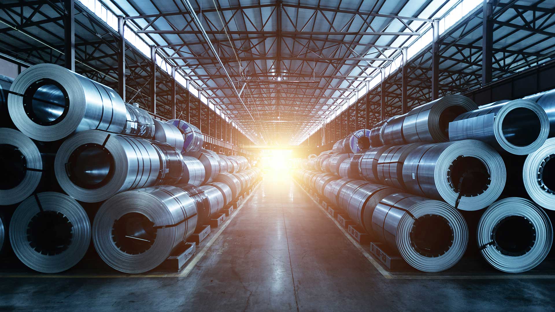Stacks of steel coils in a warehouse