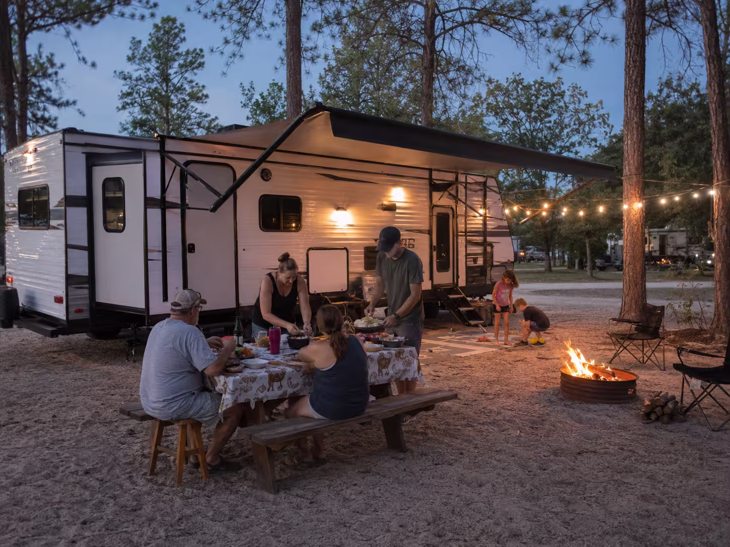 Two families sharing a large RV rental campsite near Orlando
