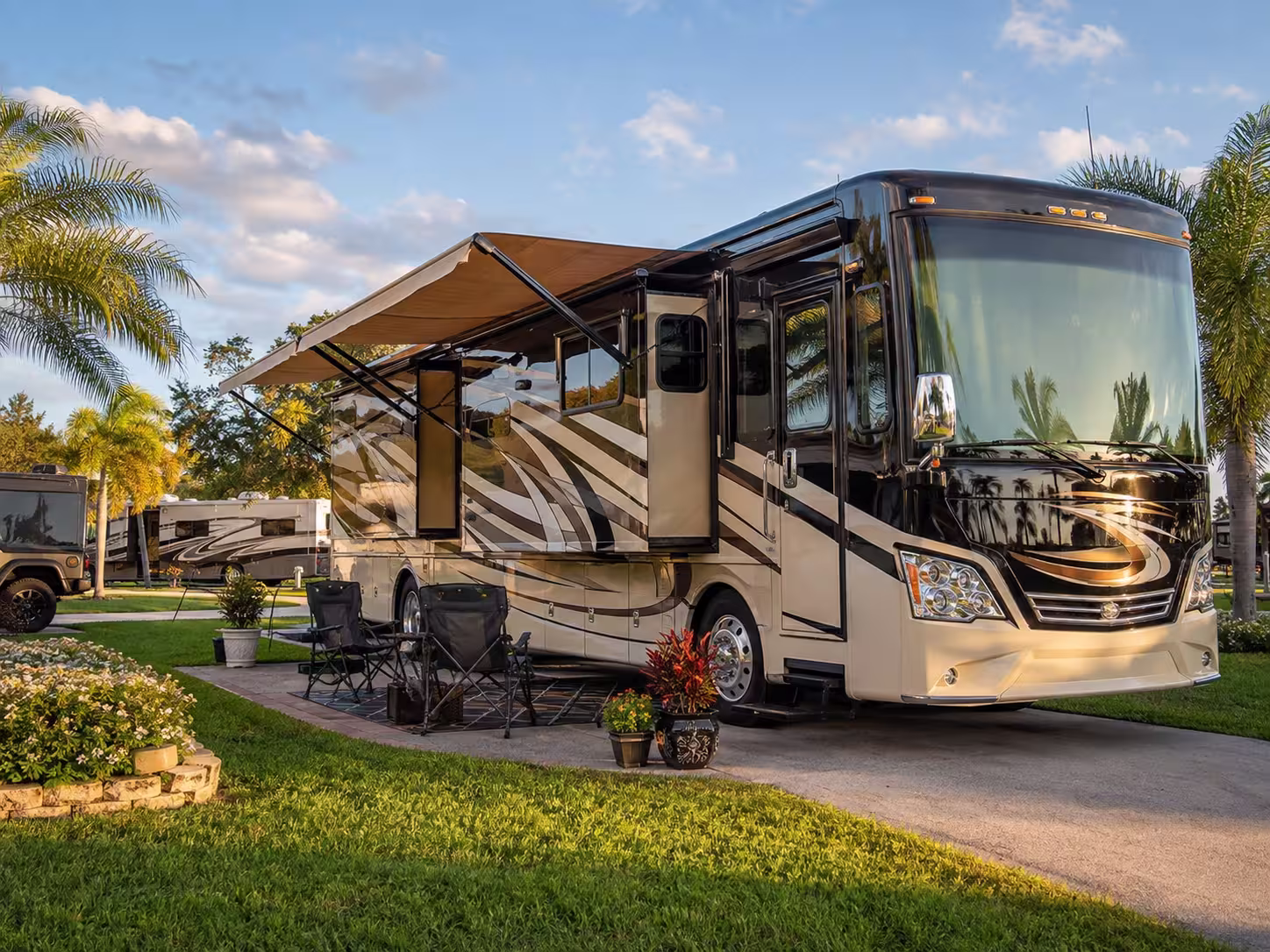 Luxury motorhome rental parked at an Orlando RV resort site