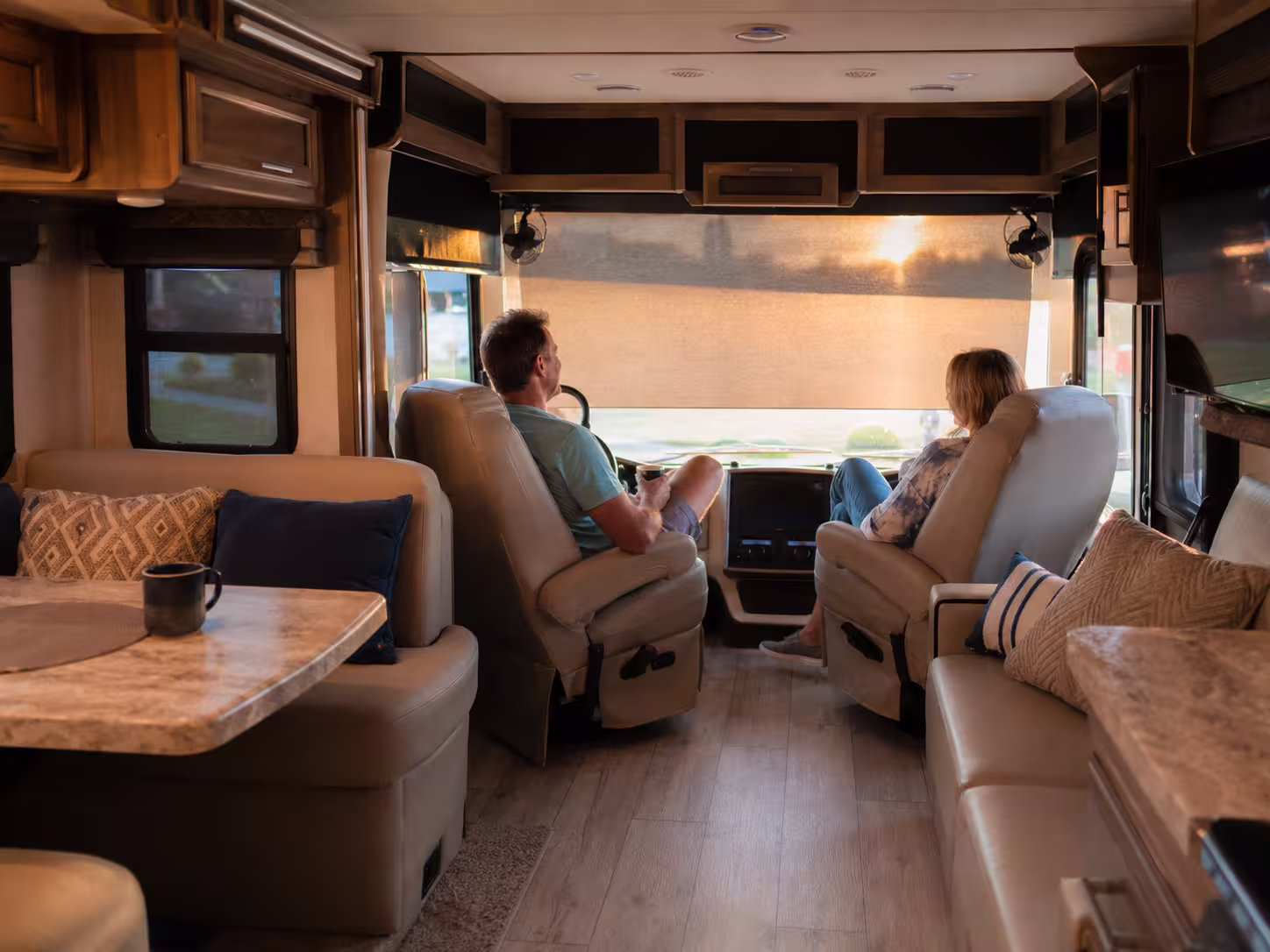 Renters relaxing inside a luxury RV rental near Orlando