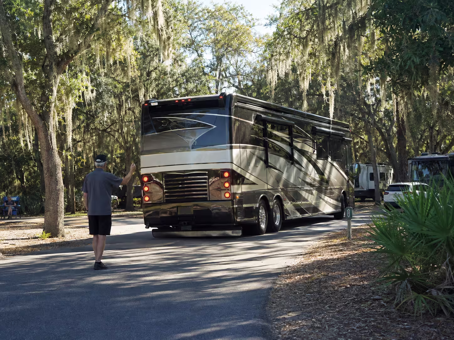 Large luxury motorhome backing into a Central Florida campsite