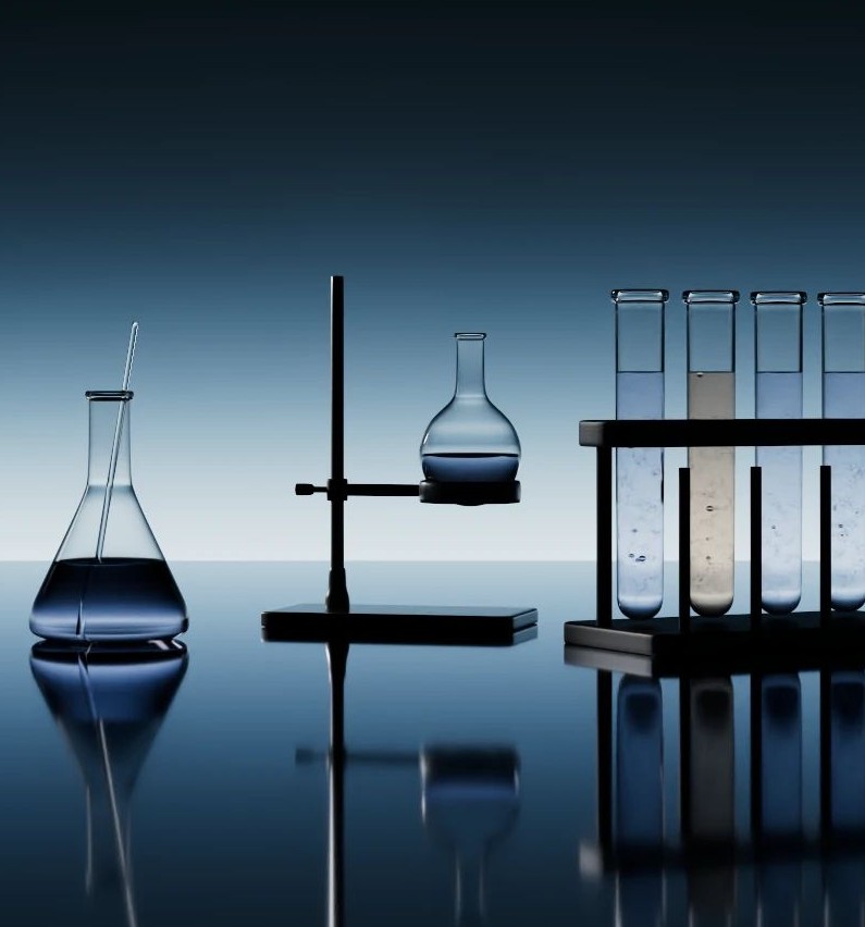 Laboratory glassware and test tubes reflected on still water