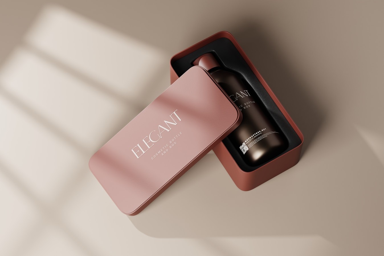 Rose-pink package box beside a dark dispenser bottle