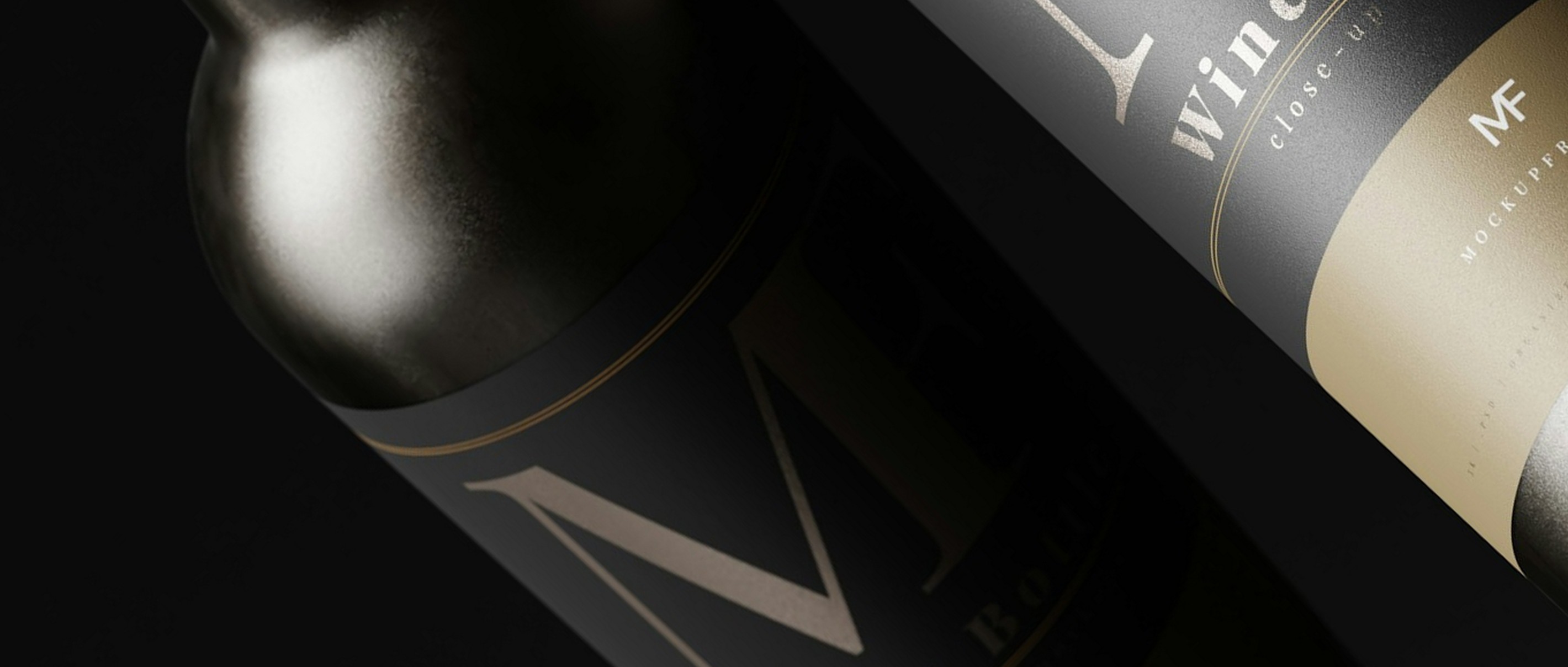Dark wine bottle with a gold label lit against warm black