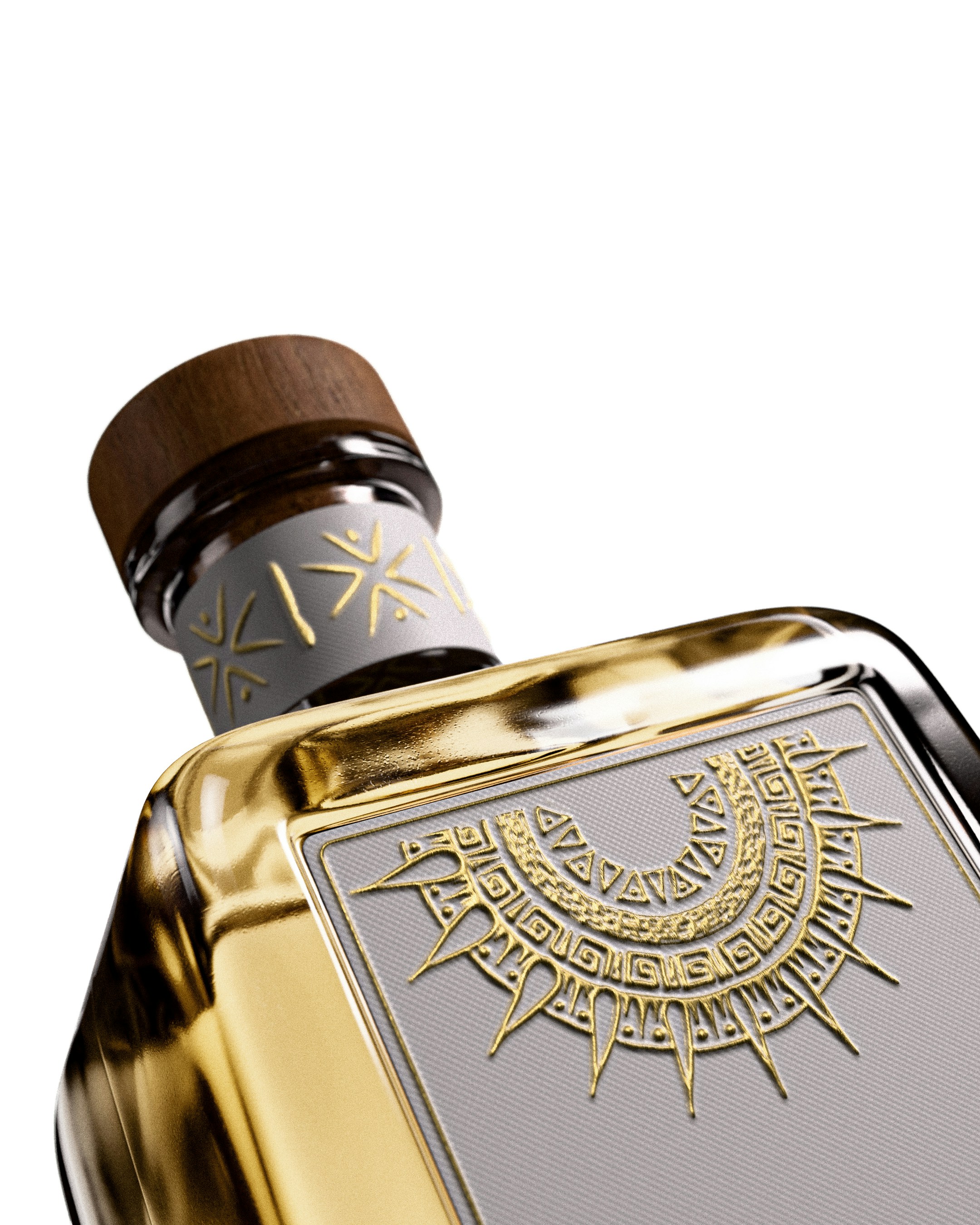 Ornate gold and silver spirits bottle with a wooden cap lit against a dark background