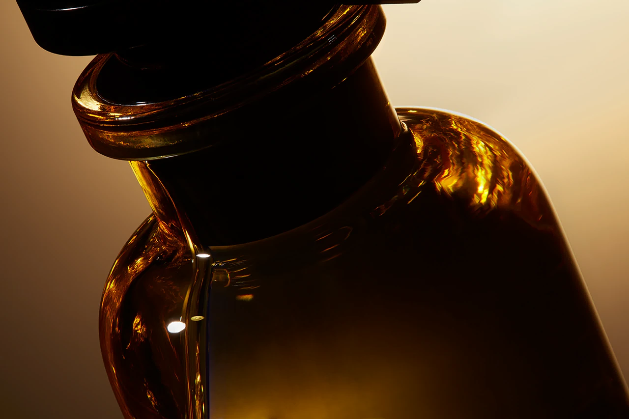Backlit amber glass jar with a dark closure