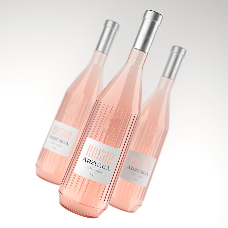 Three fluted rose wine bottles in soft pink light