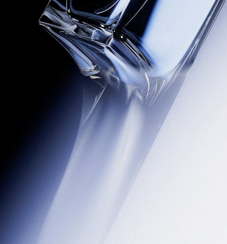 Polished stainless filling head above a production line in cool blue light