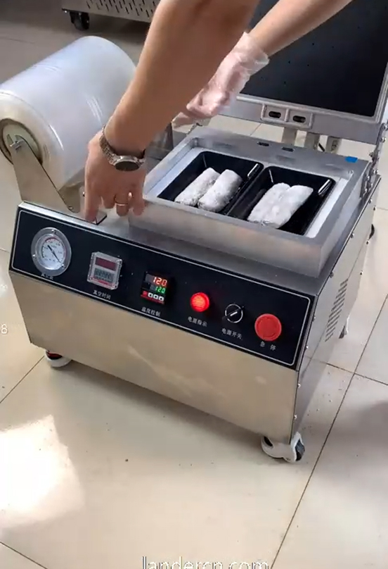 Operator running a benchtop induction sealer