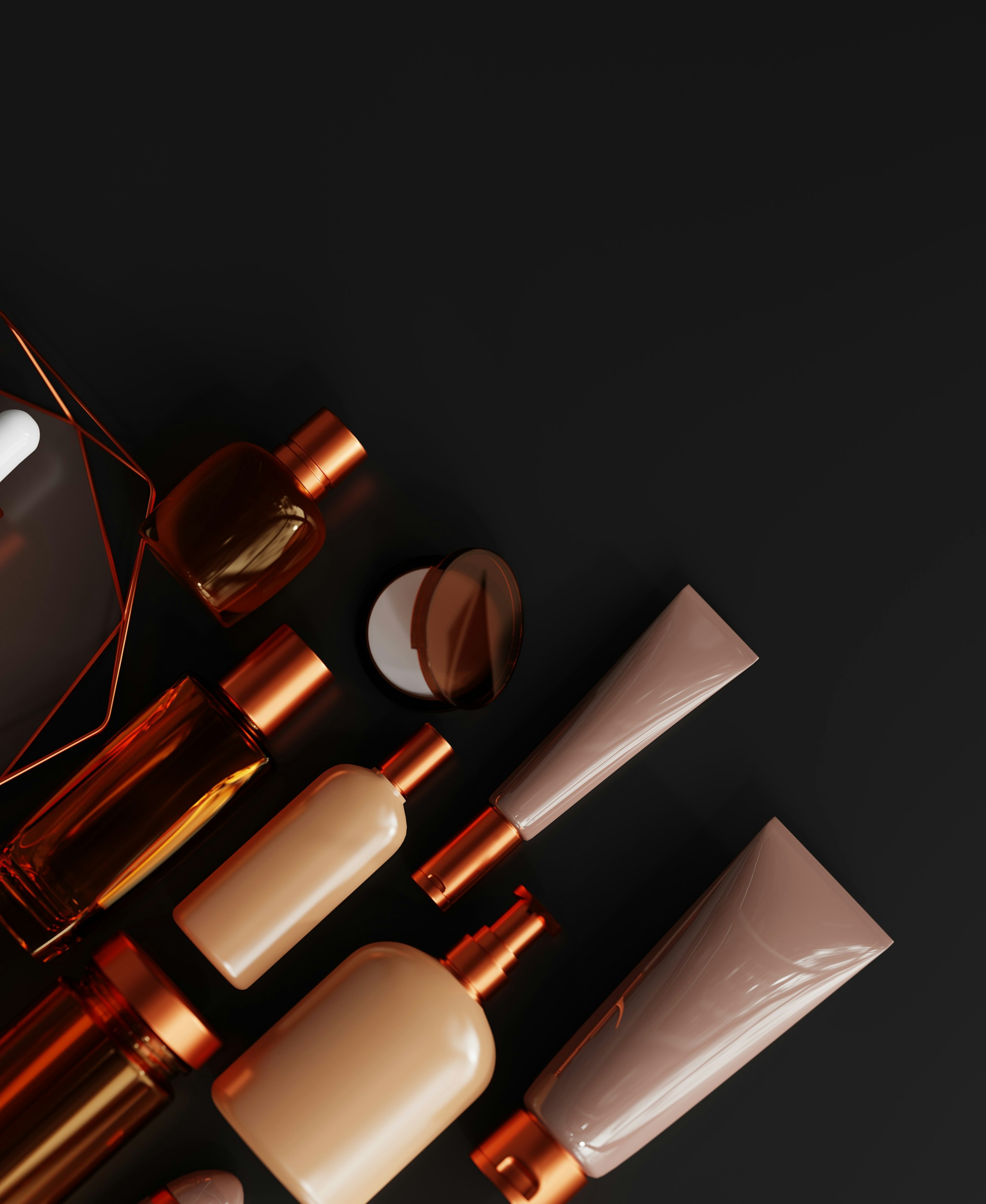 Amber and copper fragrance bottles arranged on a dark surface