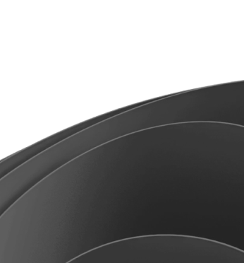 Close-up of overlapping black curved surfaces with subtle highlights.