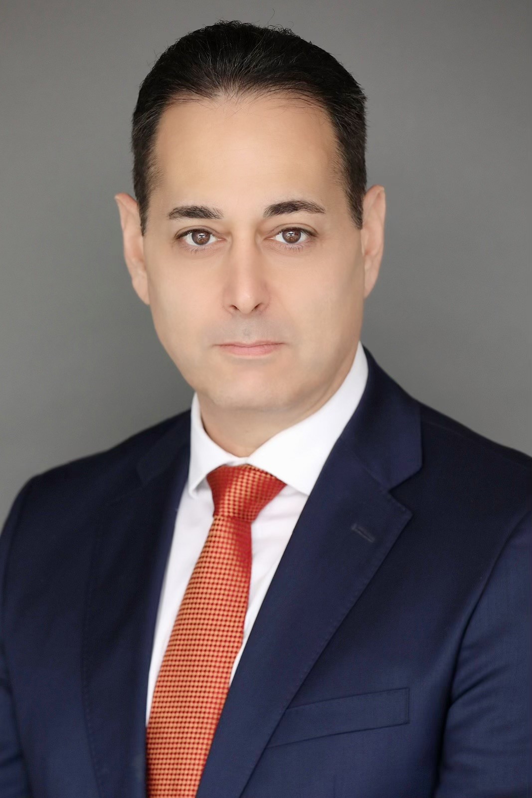 man in a coat serious looking