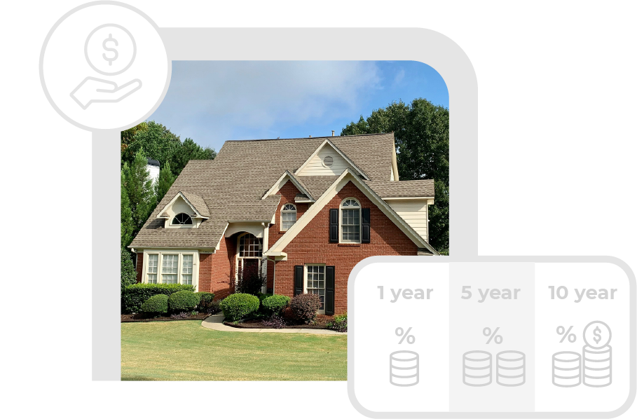 Large two-story brick house with multiple gables, arched windows, and a well-maintained front yard with trimmed bushes and green lawn under a blue sky.