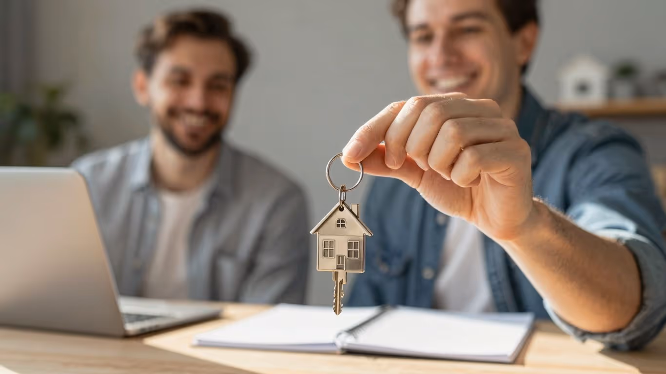 Homeowner with keys, symbolizing mortgage savings.