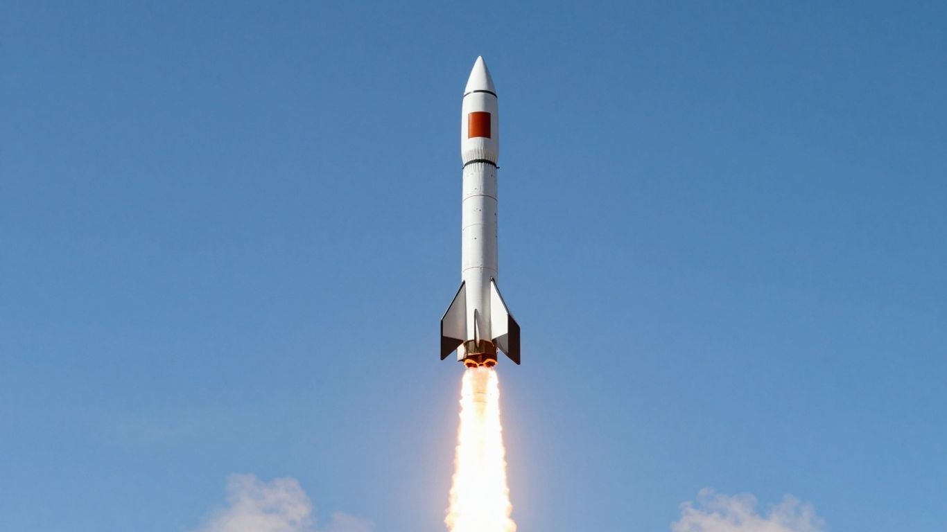 Rocket launching into a blue sky.