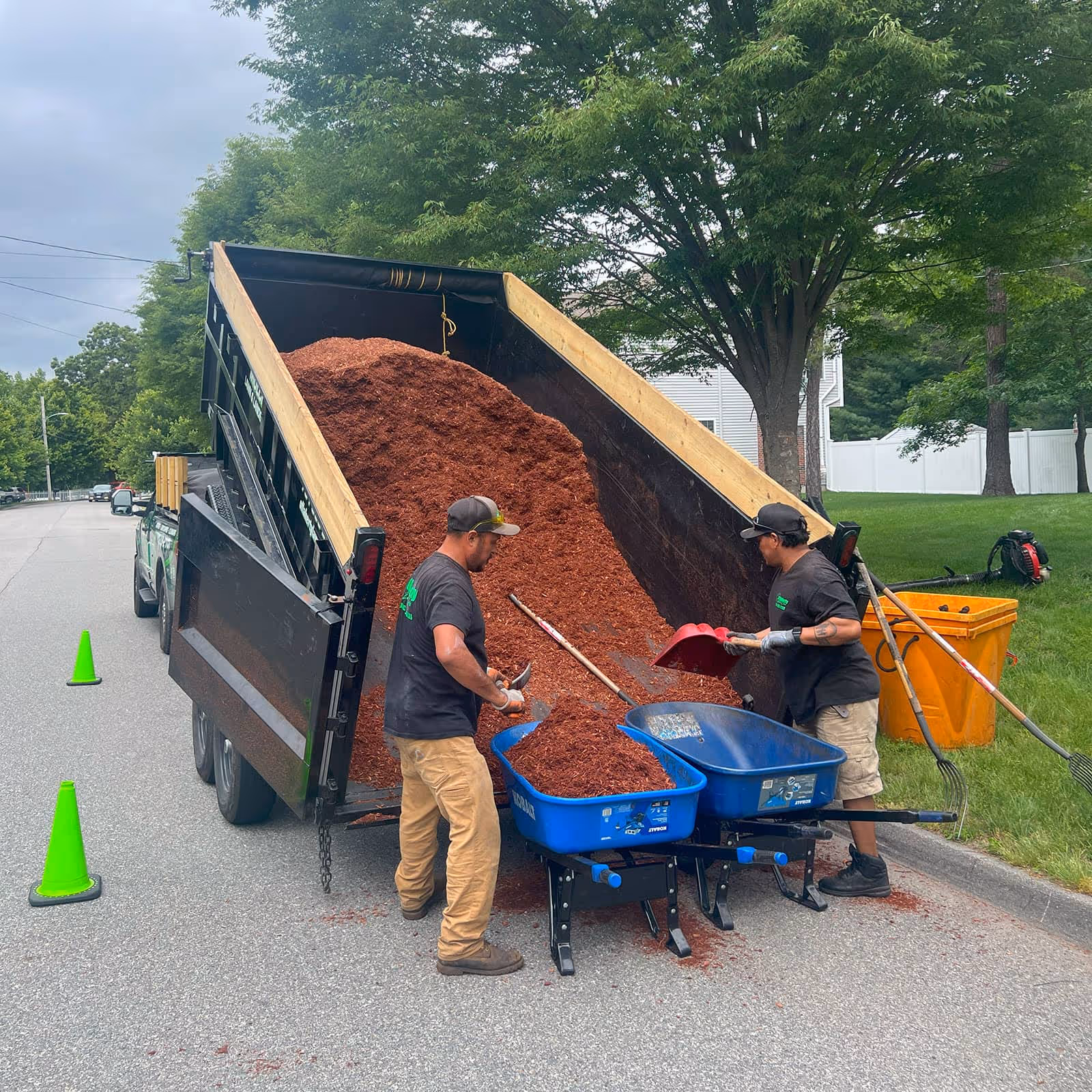 O’Flaherty Lawn Care mulch spreading and landscape enhancement