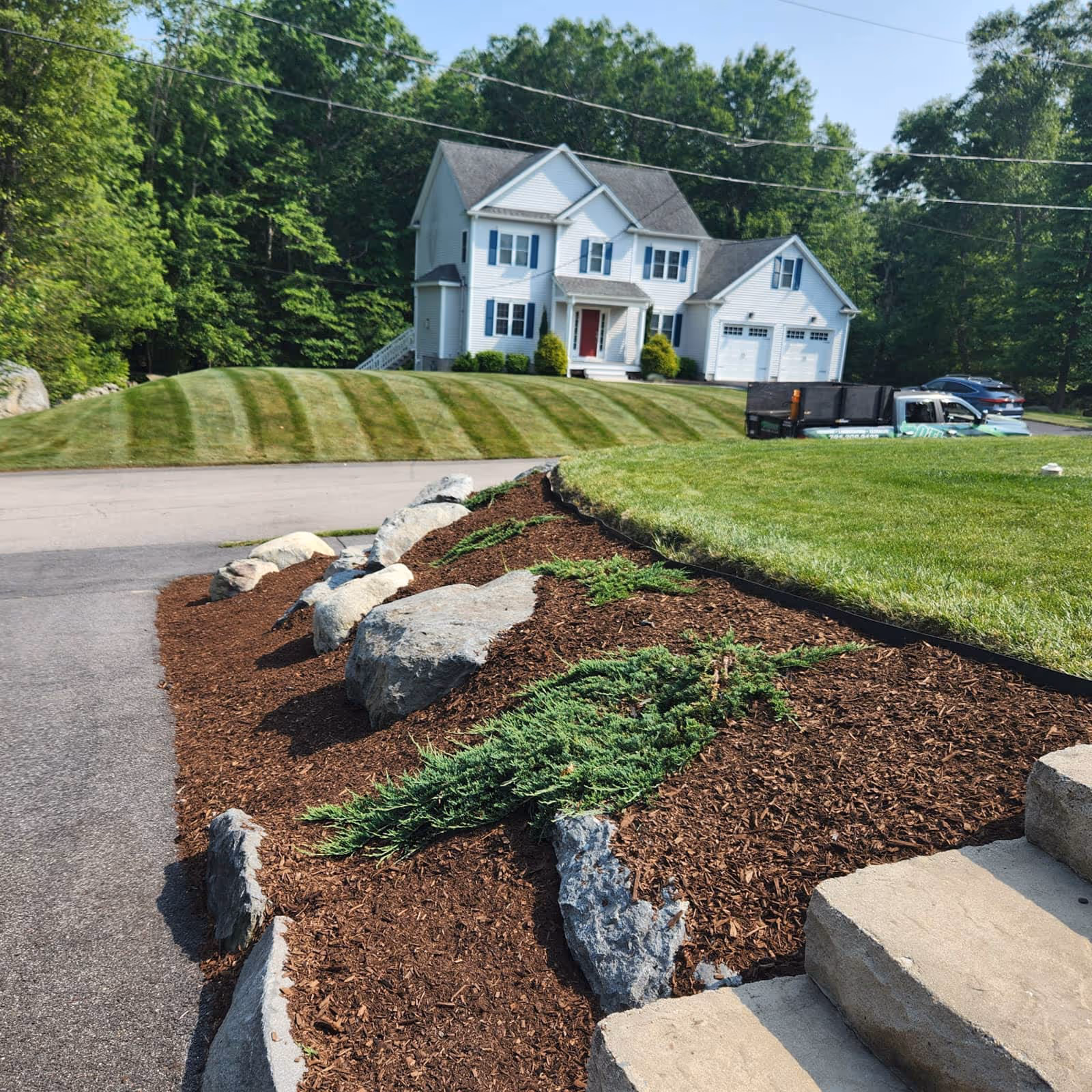 O’Flaherty Lawn Care mulch spreading and landscape enhancement