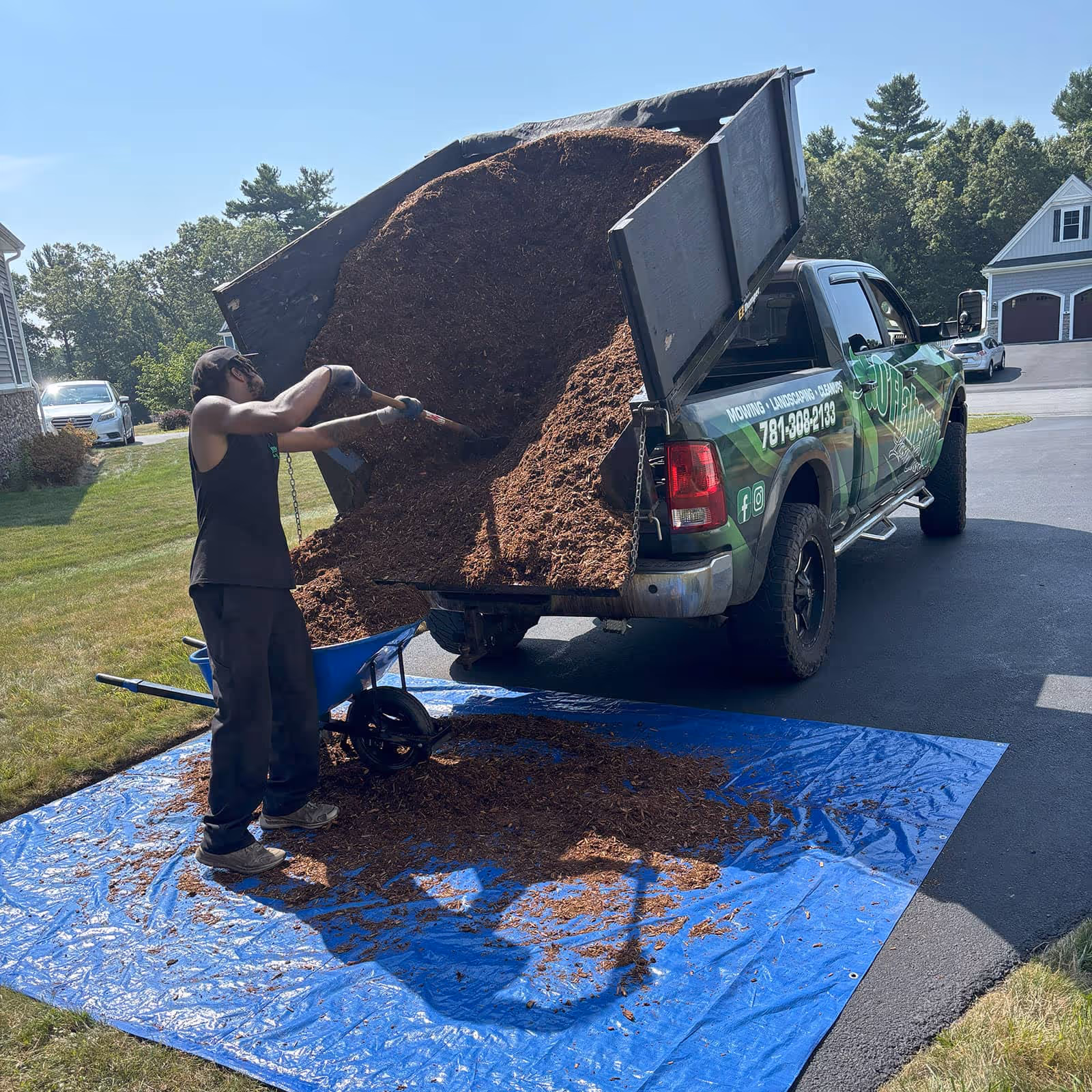 O’Flaherty Lawn Care crew using commercial lawn equipment