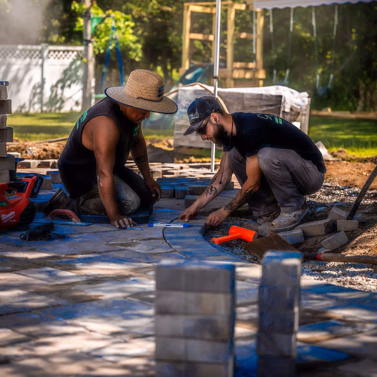 OFlaherty Lawn Care crew installing a custom hardscaping project in Attleboro Massachusetts near me