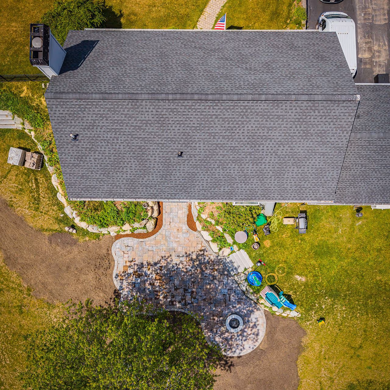 Aerial view showcasing custom patios walkways and lawn care by OFlaherty Lawn Care near me