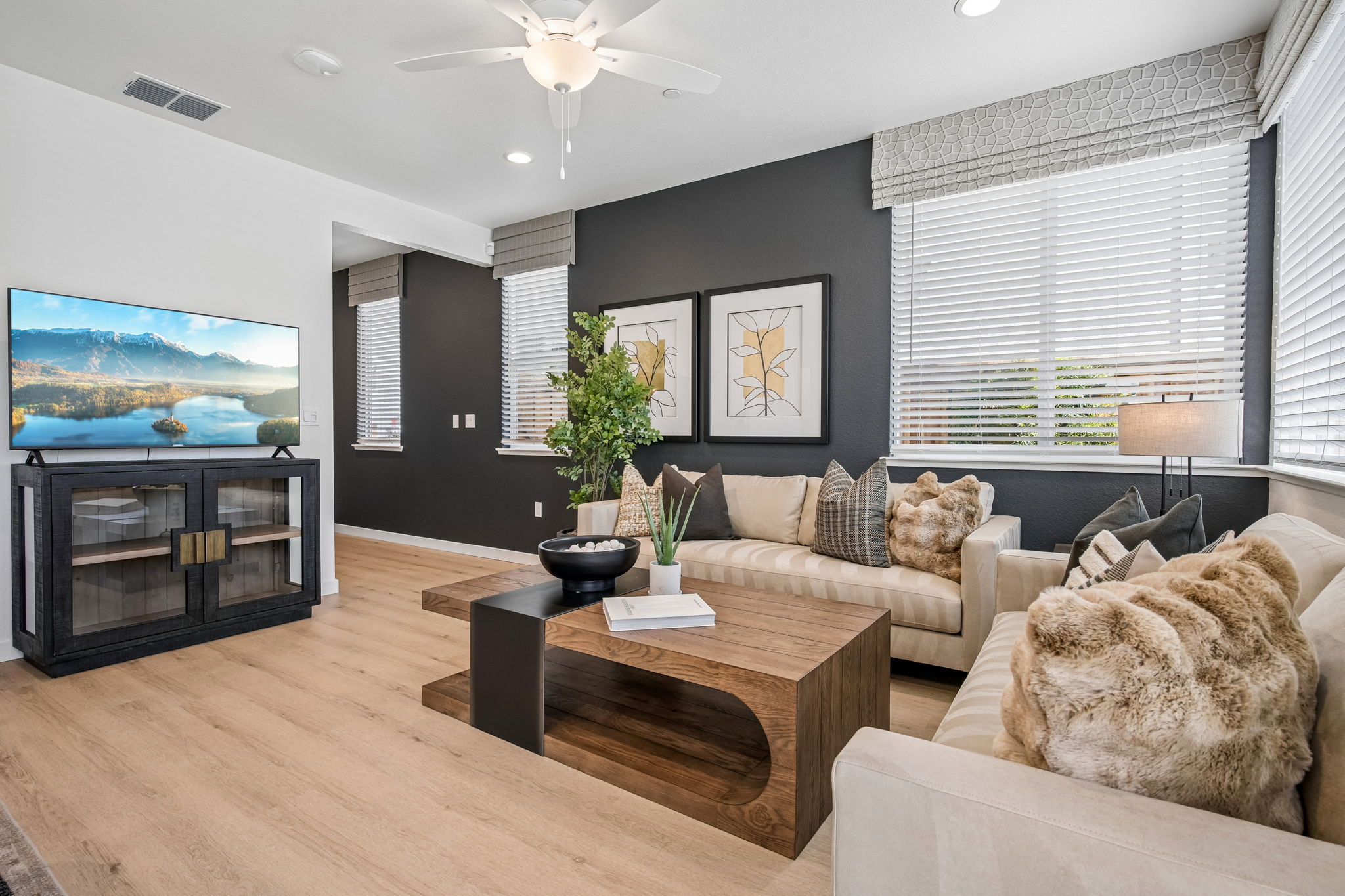 Living area with coffee table, sofa, and tv
